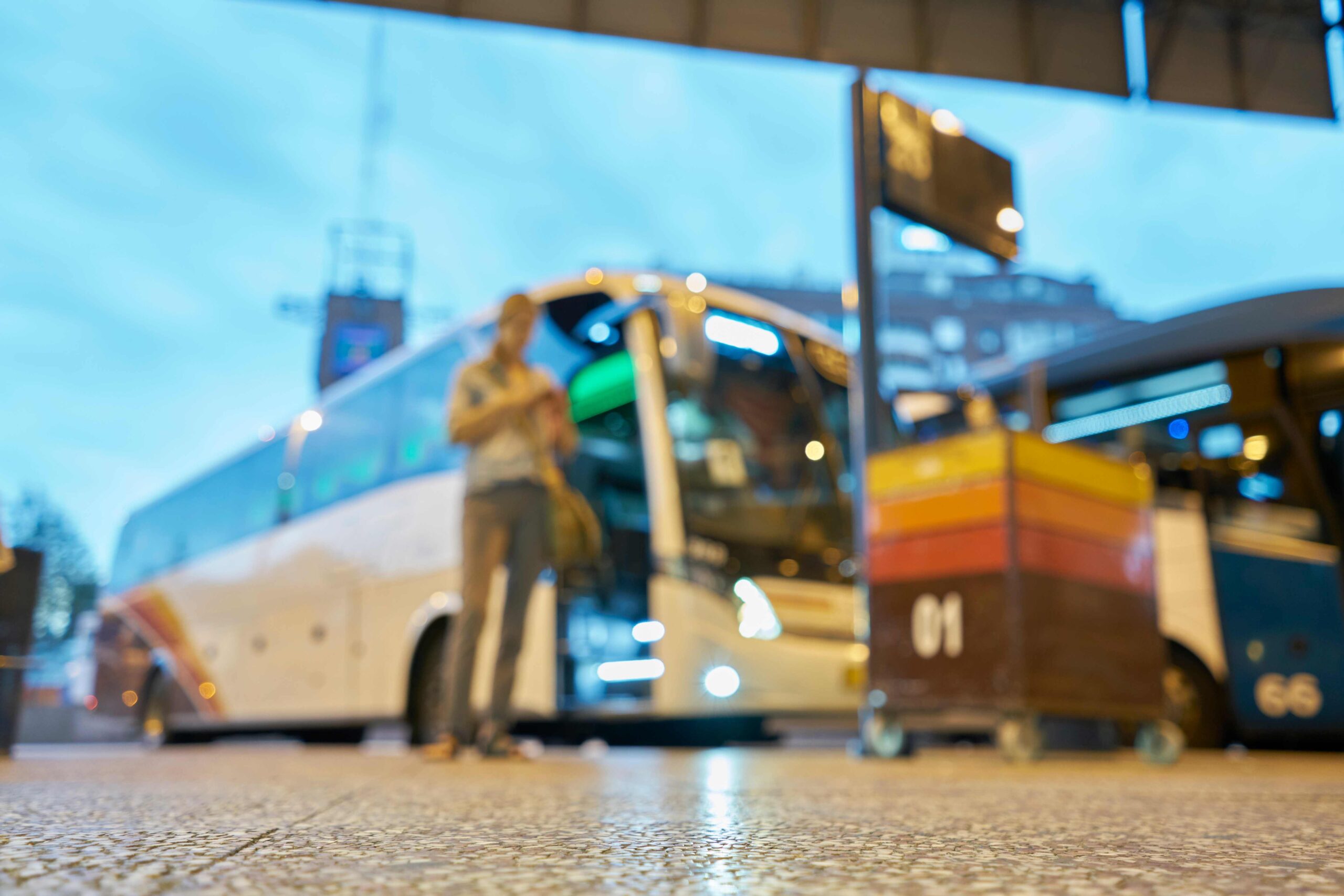 Woman standing at a bus stop