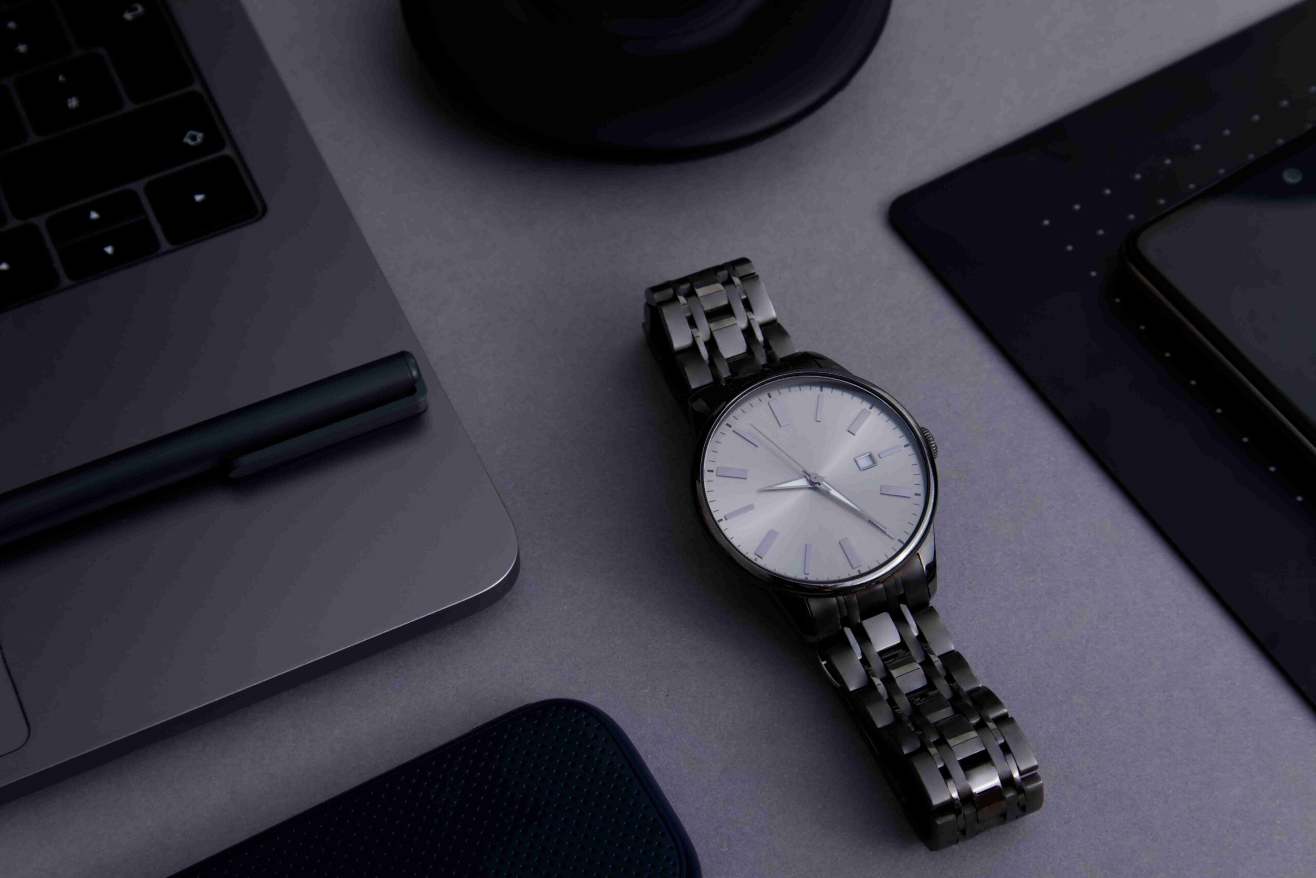 Wristwatch, laptop and mobile phone